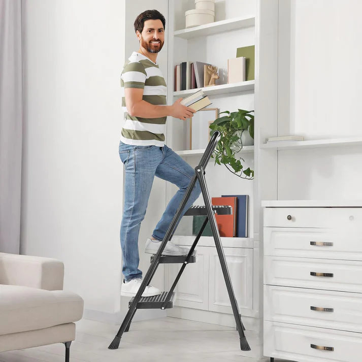 Folding three-step ladder stool with widened anti-slip steps, 800-pound weight capacity, sturdy and durable, portable with padded handle, lightweight and easy to use